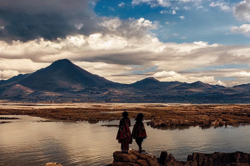 Traditional Mexican Style: Two People Standing on Rocks with Clouds and Mountains